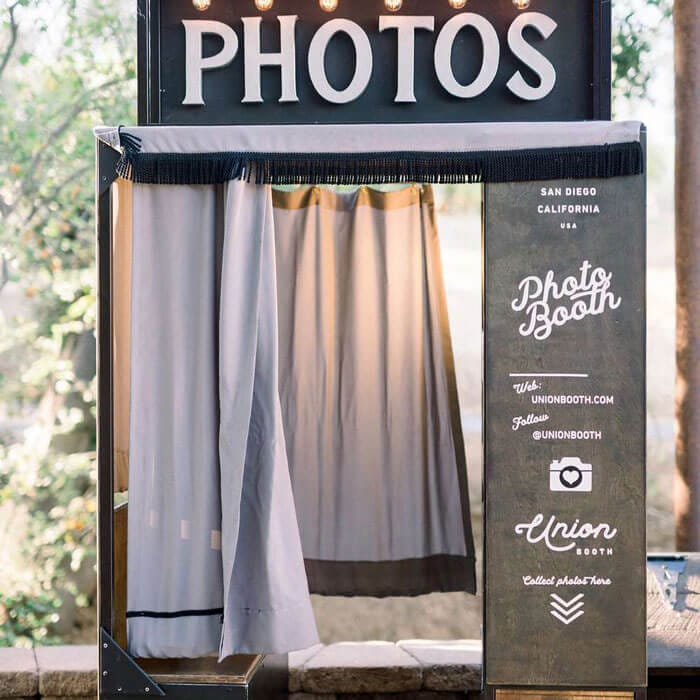 a old photo booth with a curtain