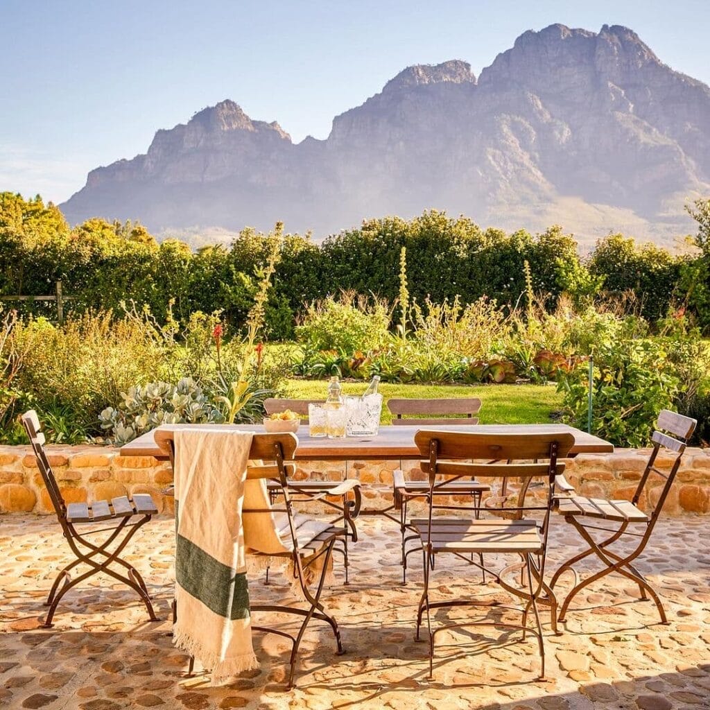 Boschendal's view from bedroom with rustic chairs