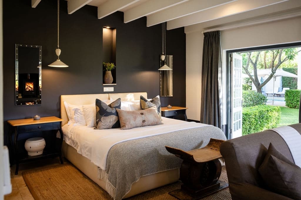 Grande Provence bedroom setting and french doors to garden